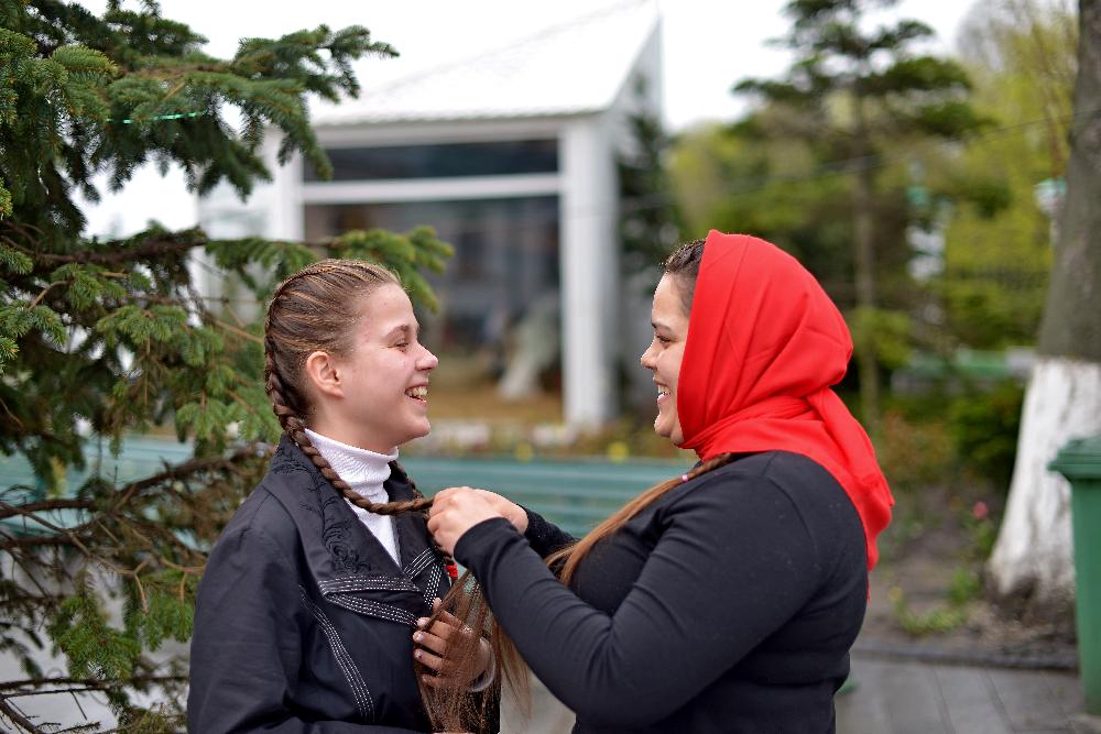 Kiev-Pechersk Lavra, Christian girlfriends weave braids, photo lovers, Orthodox girls laugh, Christian beauties, Lavra workers, girls sellers in a shop